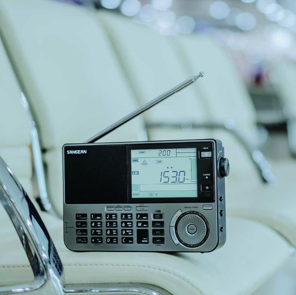 a SANGEAN ATS-909X2 on the chair at airport